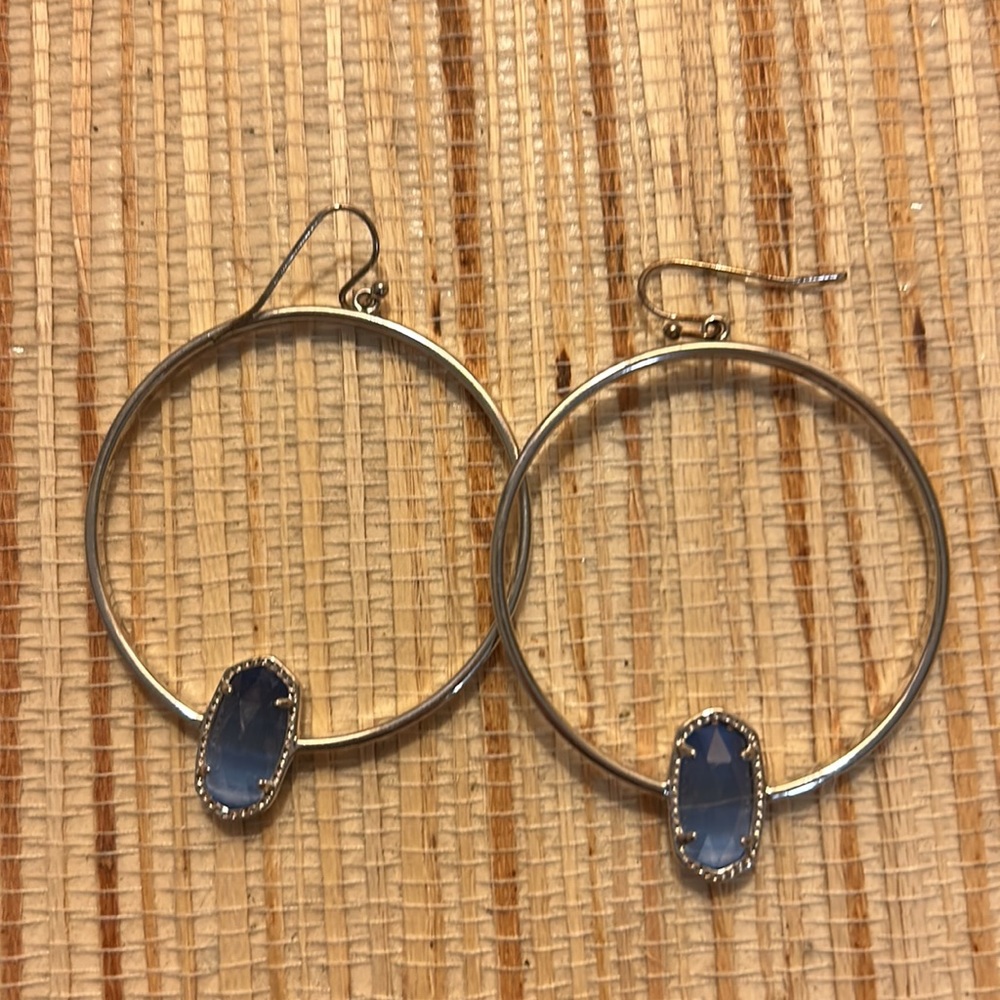 Kendra Scott silver hoops with blue stones.